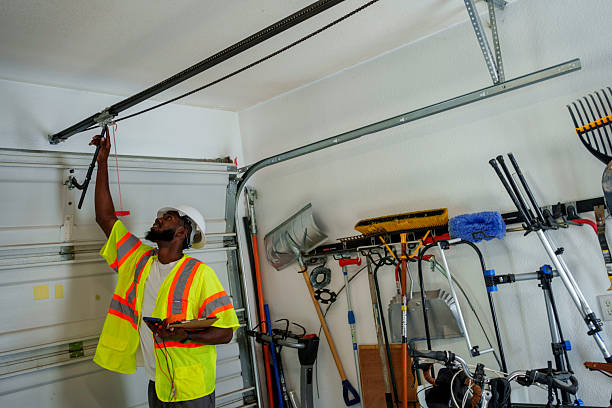 Professional Garage Door Panel Replacement technician working in Watertown, NY